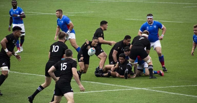 Rugby sport played by two teams wearing red and blue.