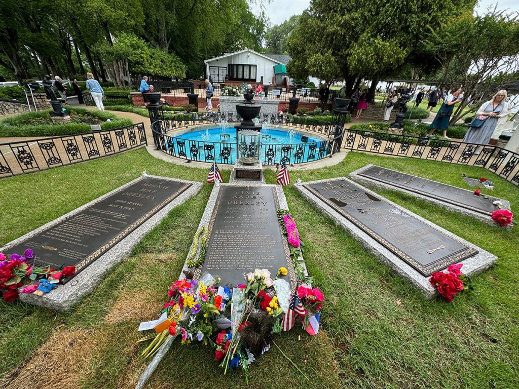 Elvis Aaron Presley, flanked by his grandmother to the left and his parents on the right
