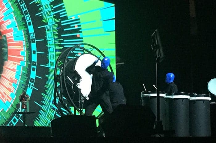 Blue Man Group performing on stage over lunch
