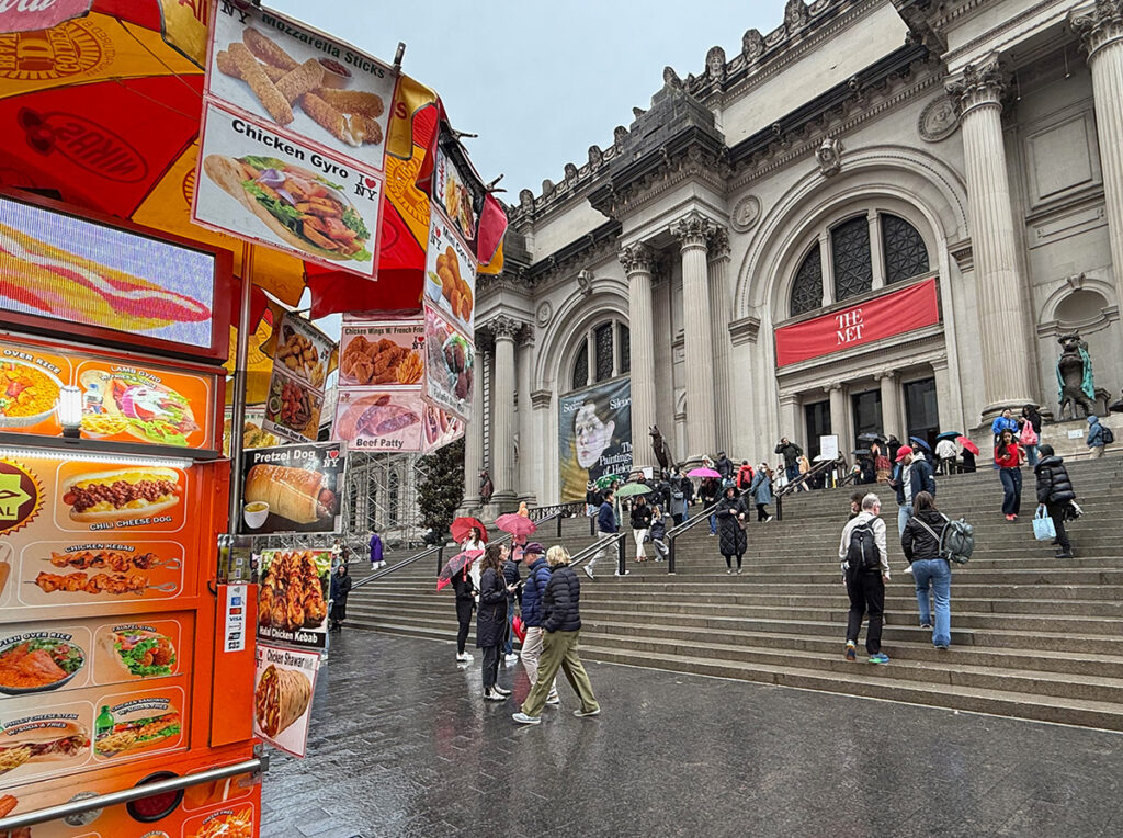 Food cart outside The Met on a rainy day
