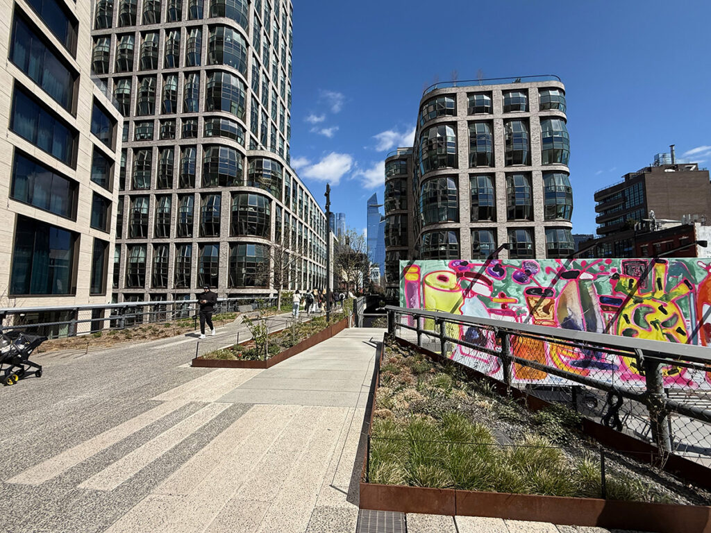 Walking along the High Line past quirky murals and buildings