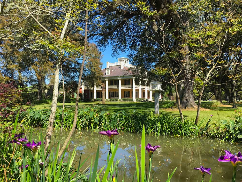 Houmas House with pond and flowers