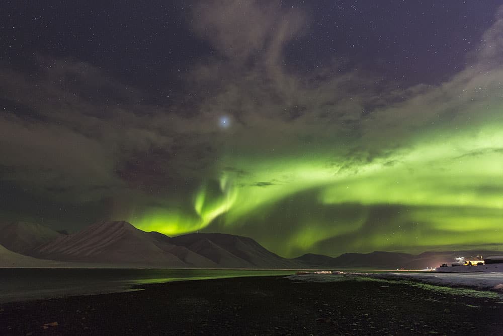 Northern lights over mountains