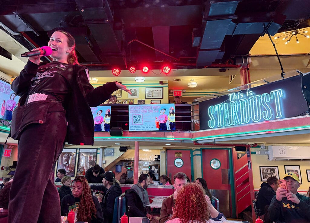 Waitress singing at Ellen's Stardust Diner