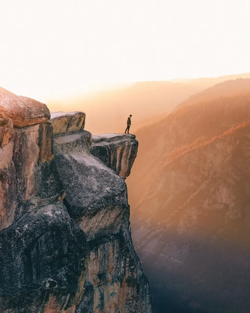 Man on cliff in Yosemite