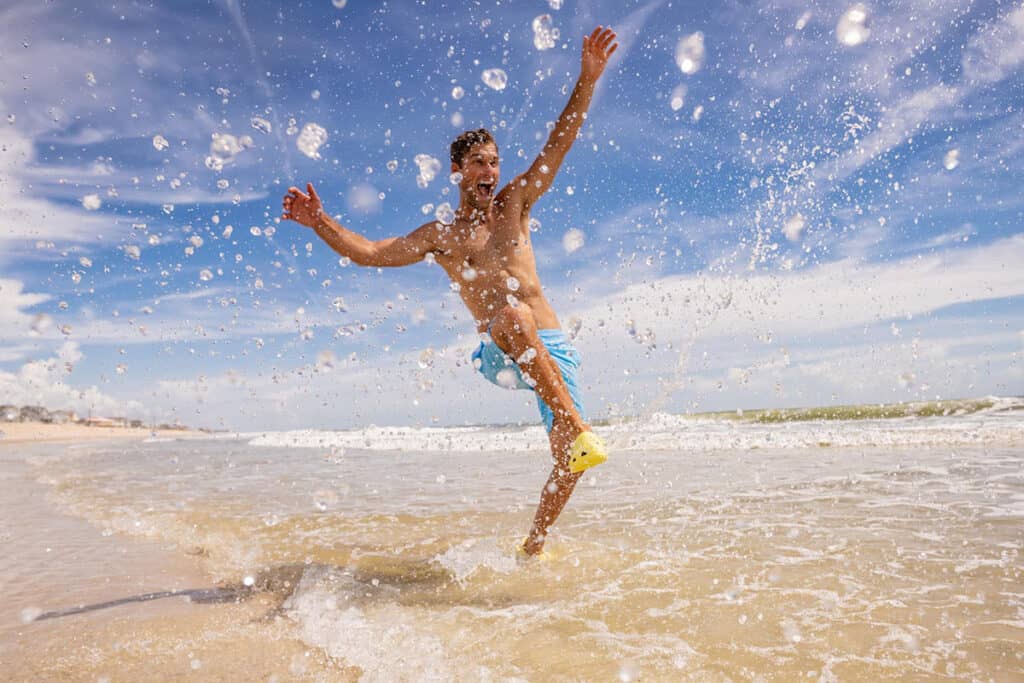 Guy splashing in sea