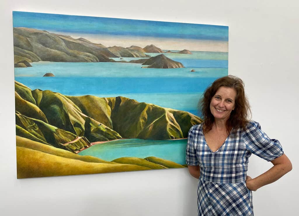 Melanie Roger with a Stanley Palmer painting