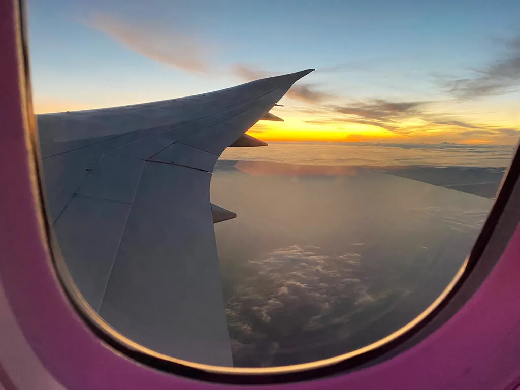 Sun setting from plane window