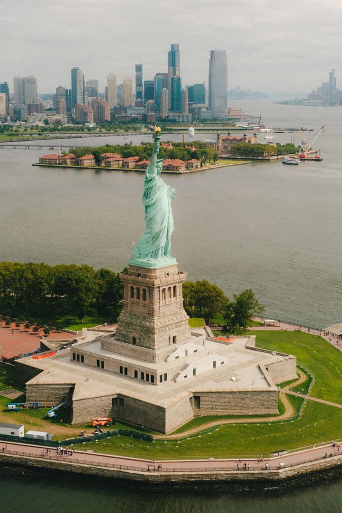 Lady Liberty with Ellis Island in the back ground