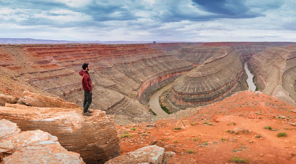 A hiker looking over Goosenecks, Utah