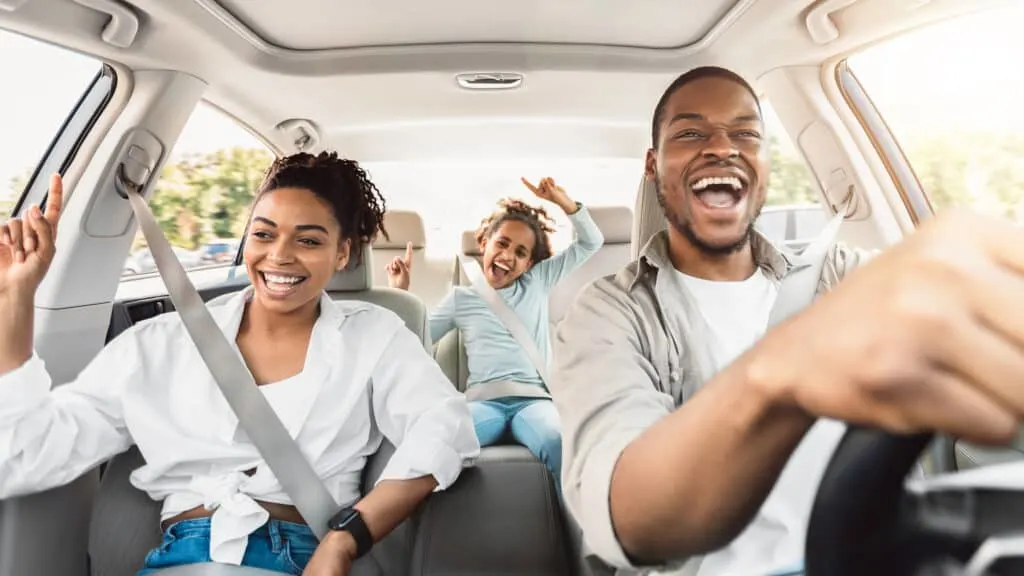 Family in car on road trip