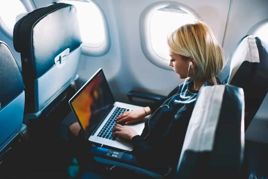 https://www.bloggeratlarge.com/wp-content/uploads/2022/08/Woman-working-on-plane-1024x684.jpg.webp