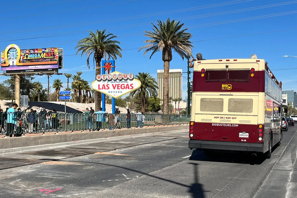 Welcome to Las Vegas sign and Hop On Bus