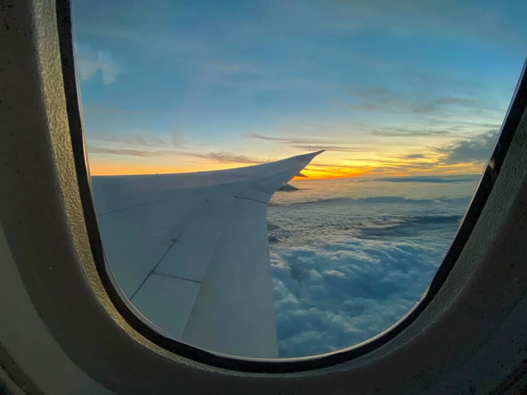 Plane wing at sunrise