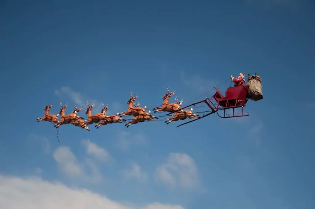 Santa flying with reindeer