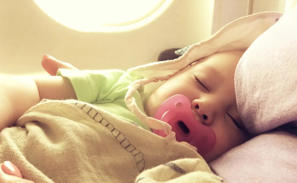 Child asleep on plane