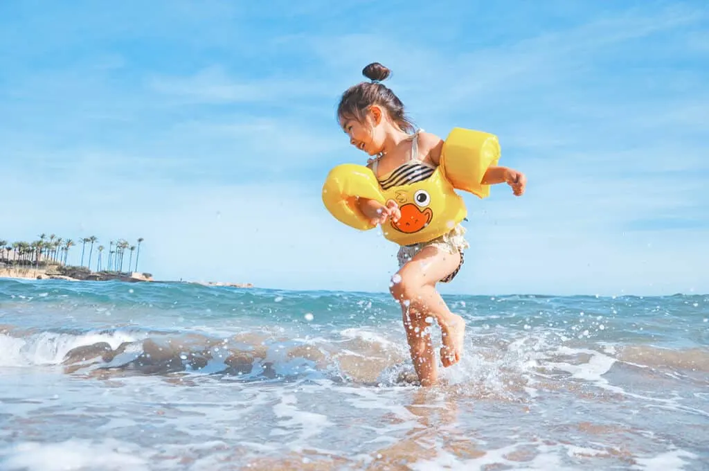 Child splashing in the sea