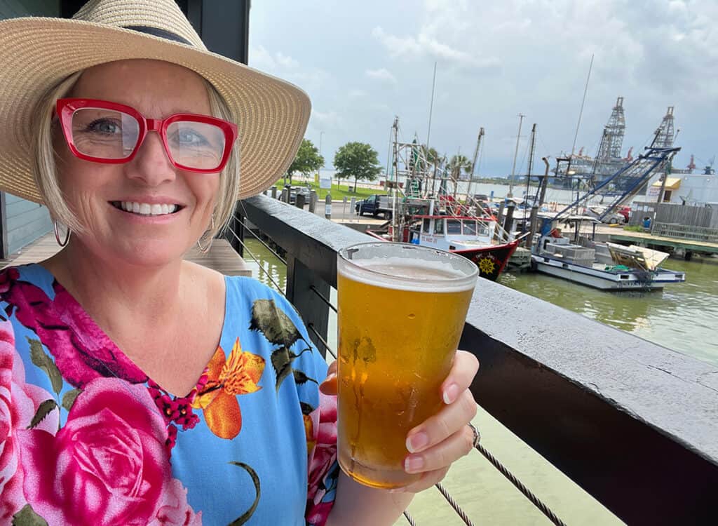 Megan with a beer at Katie's, Galveston