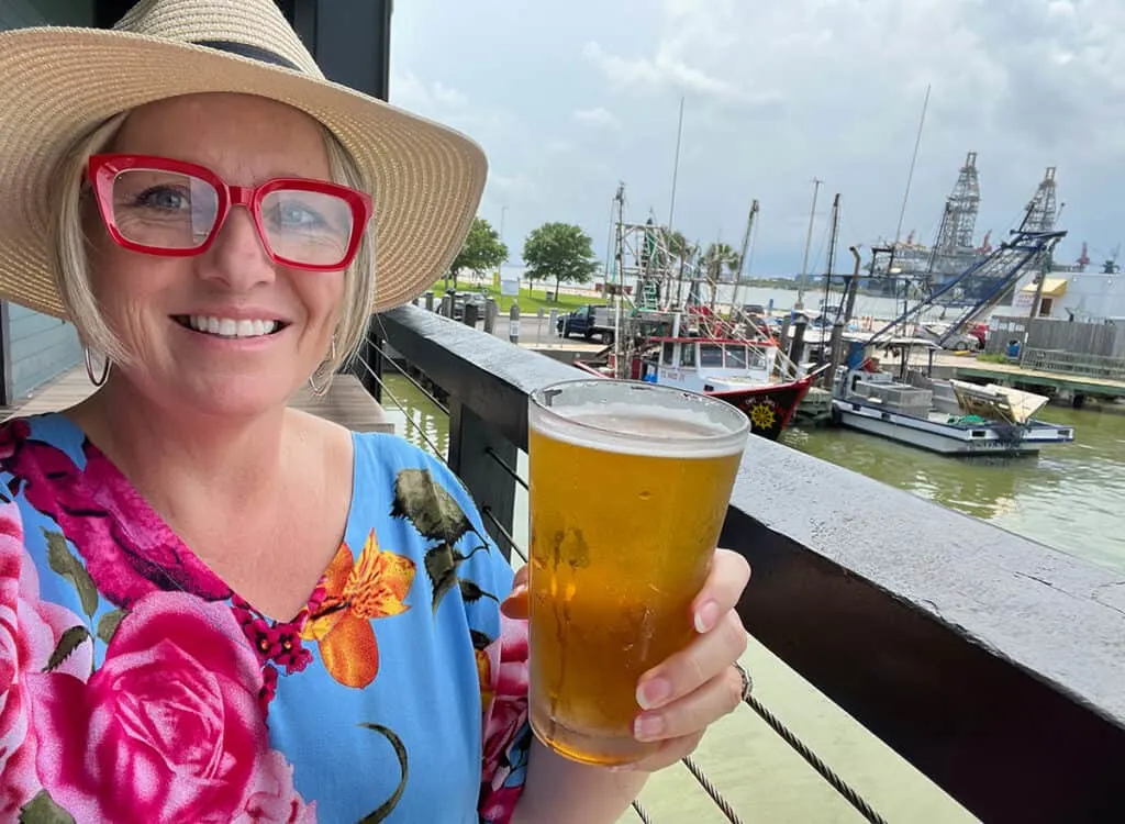 Megan with a beer at Katie's, Galveston