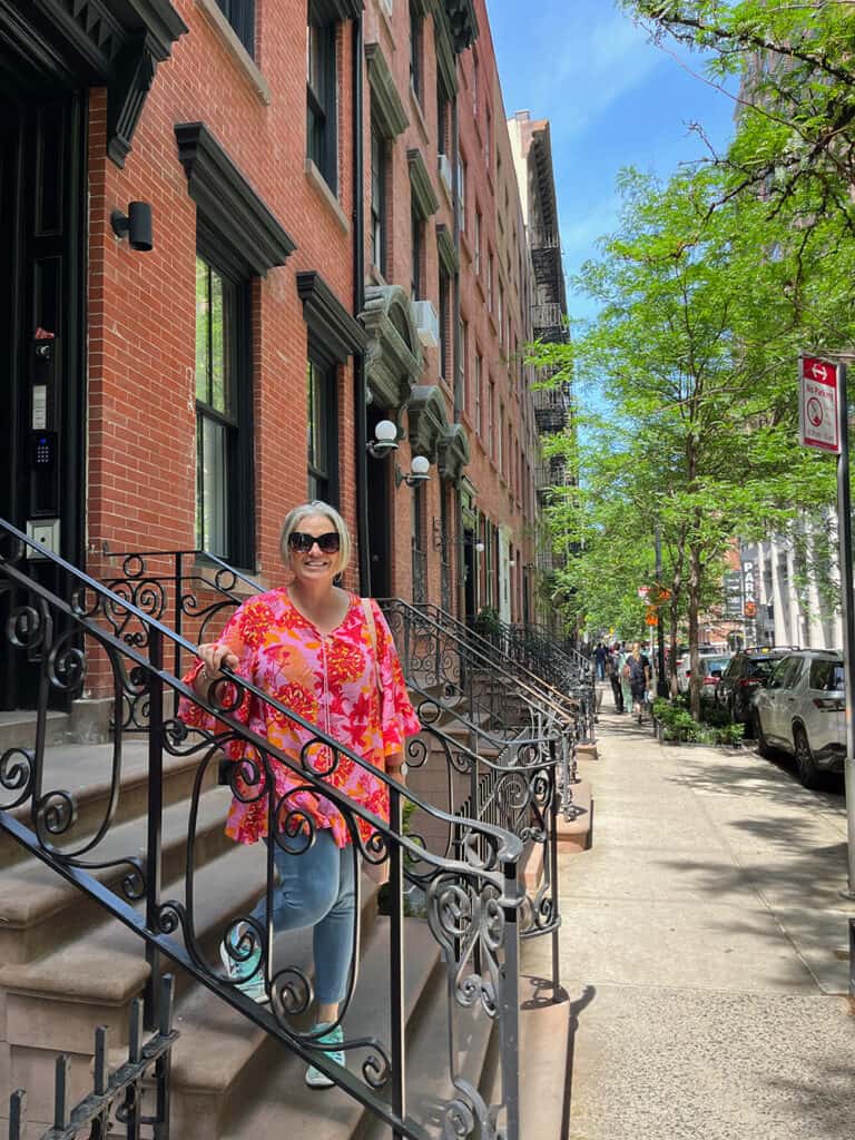 Megan on steps of apartment