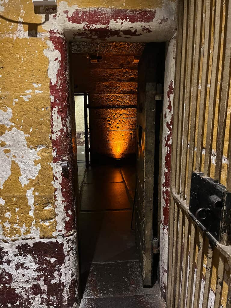 Jail cell at night at the Old Melbourne Gaol