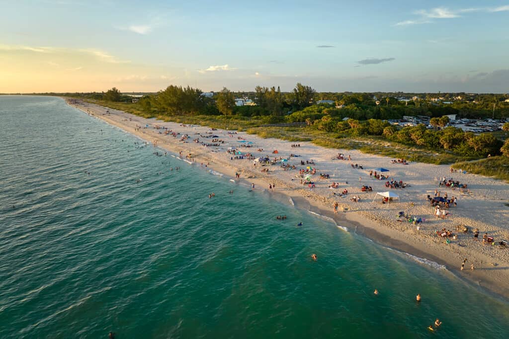 Nokomis Public Beach dotted with sunbathers and picnickers