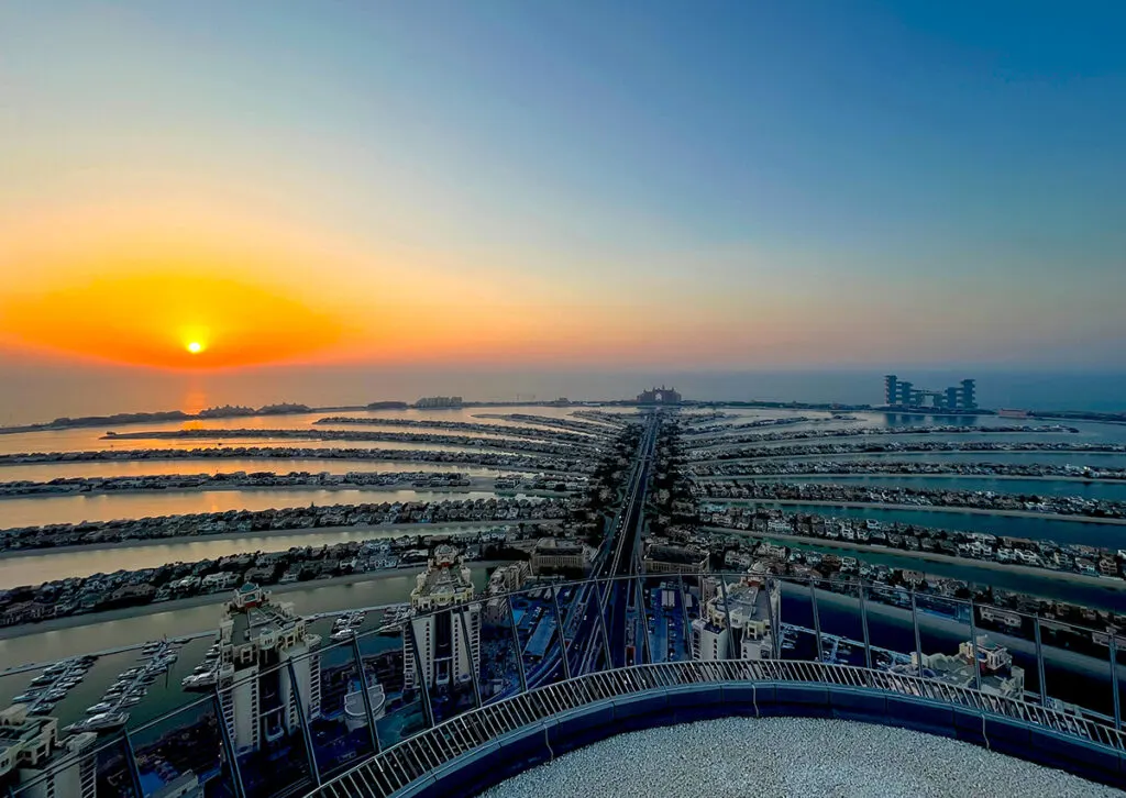sun set over Dubai's famous palm tree island