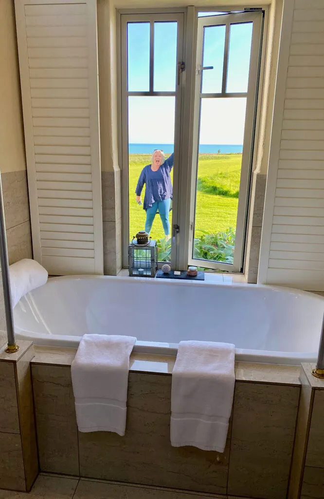 Megan at Wharekauhau Country Estate through bathroom window