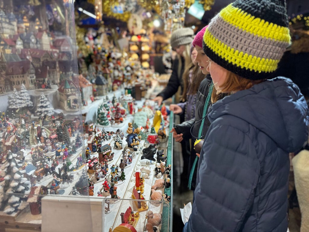 Children browsing a market stall