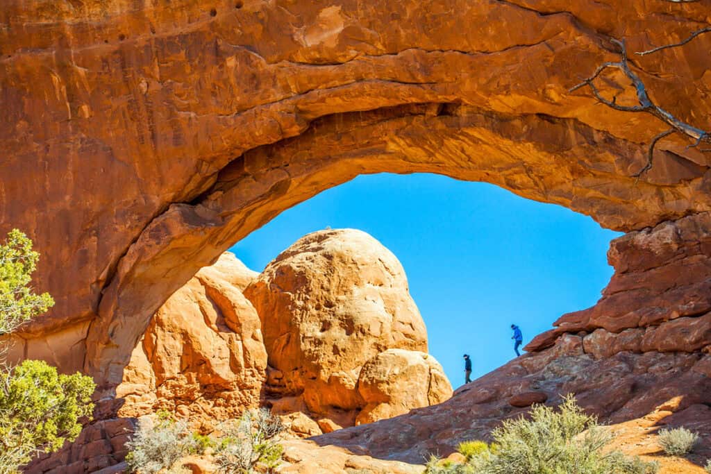 People hiking Arches National Park