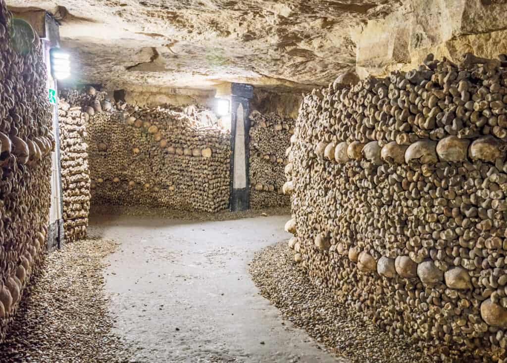 Skulls and bones on display in the Paris Catacombs