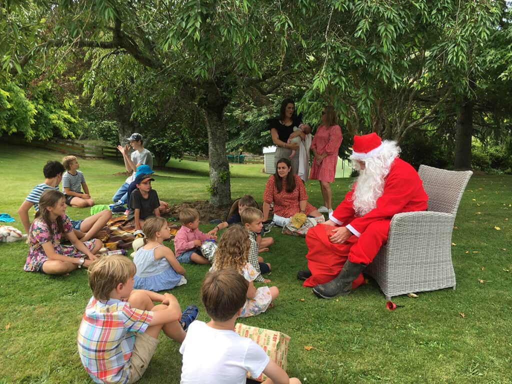 Santa giving gifts to the kids