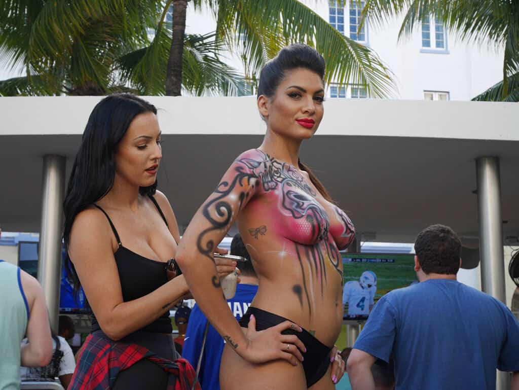 Body painting team colors at The Clevelander