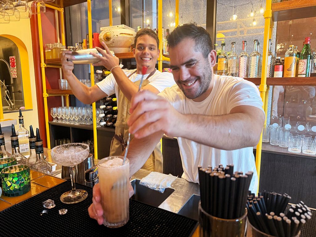 Staff shaking cocktails at Mijita