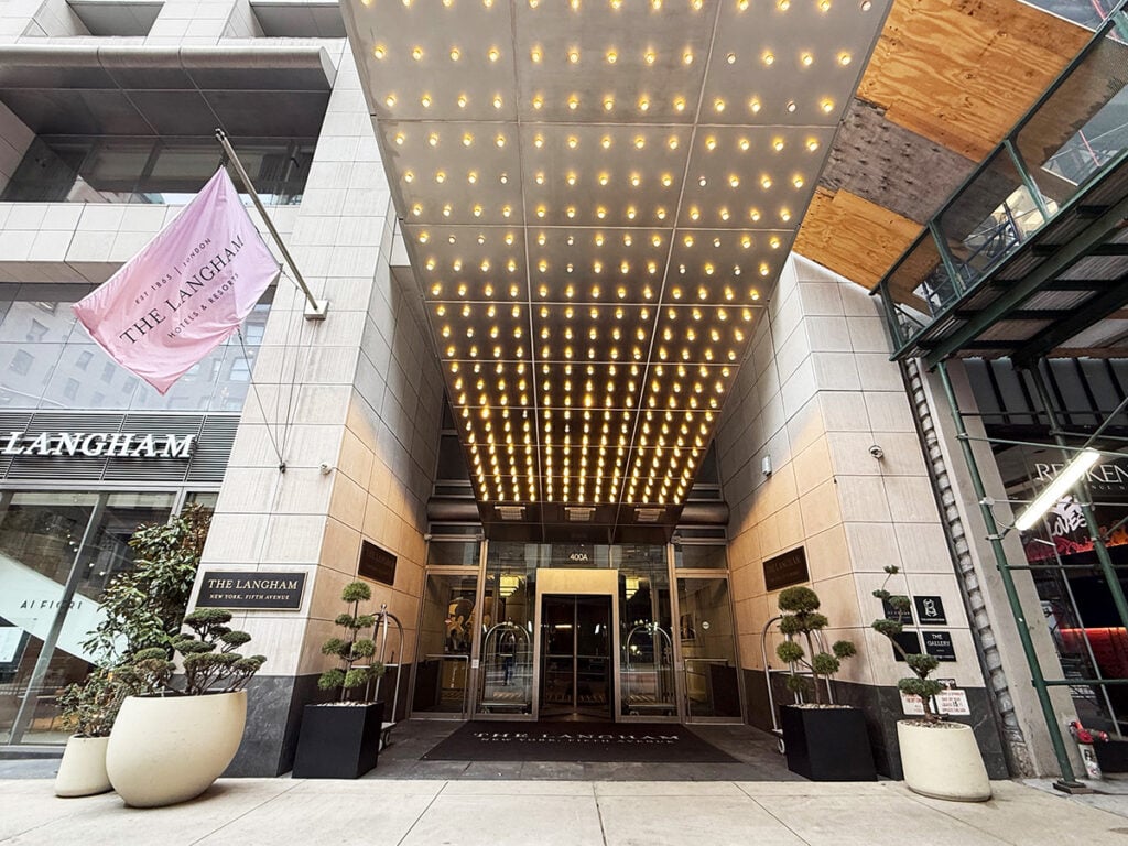 The grand entrance with lights above of the Langham New York