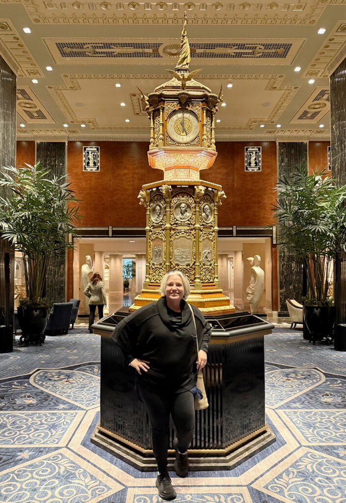 Megan standing in front of the famous Waldorf Astoria clock