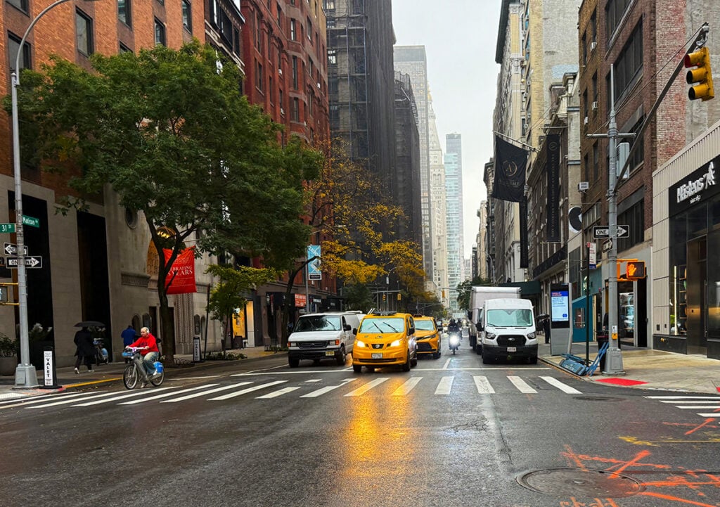Yellow cab with reflecting lights on a rainy day in New York City
