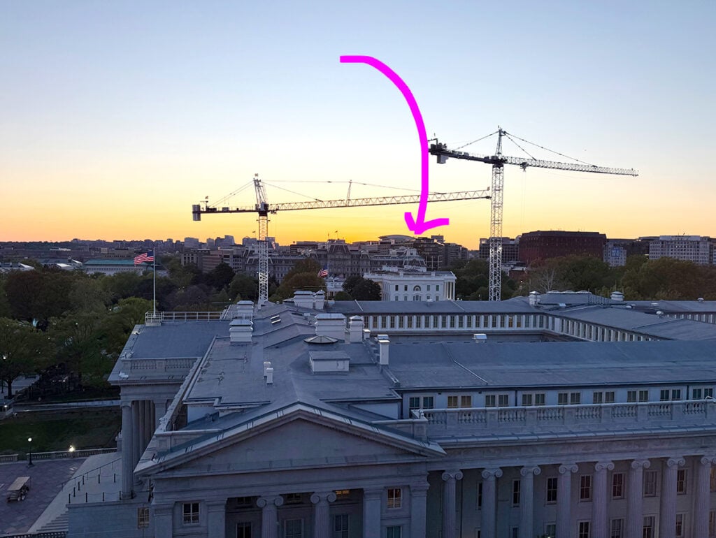 The view from VUE rooftop at Hotel Washington of the White House with cranes building the new extension