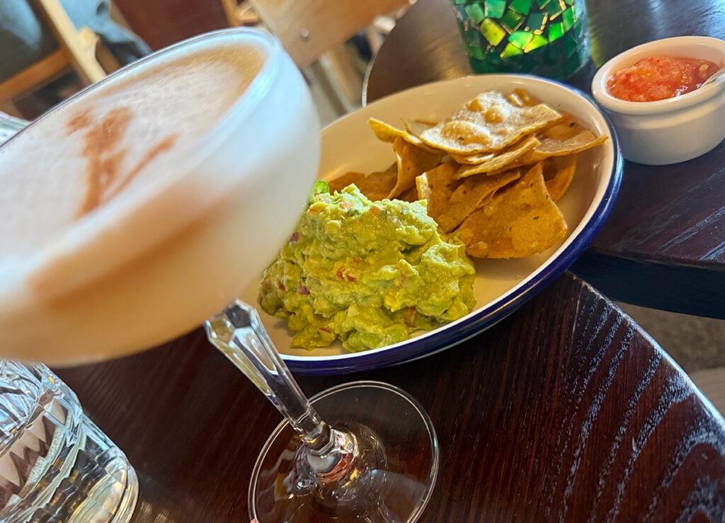 My guac and chips and a cocktail at Mijita