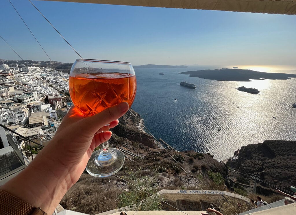 My aperol spritz toasting the cruise ships at Santorini