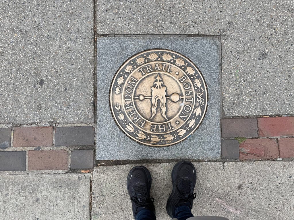 Megan's feet on Freedom Trail marker