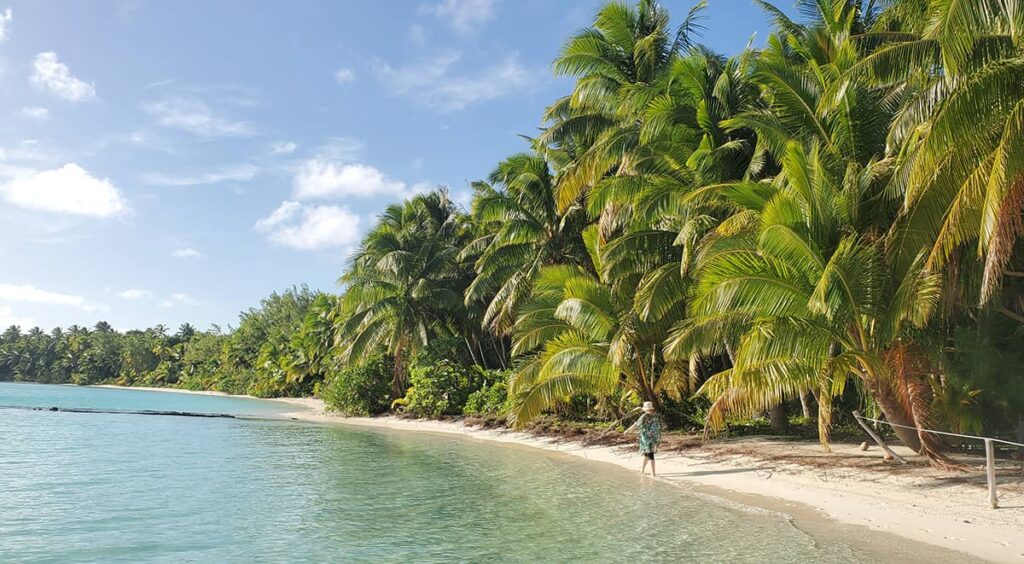 Megan walking in the lagoon at Aitutaki