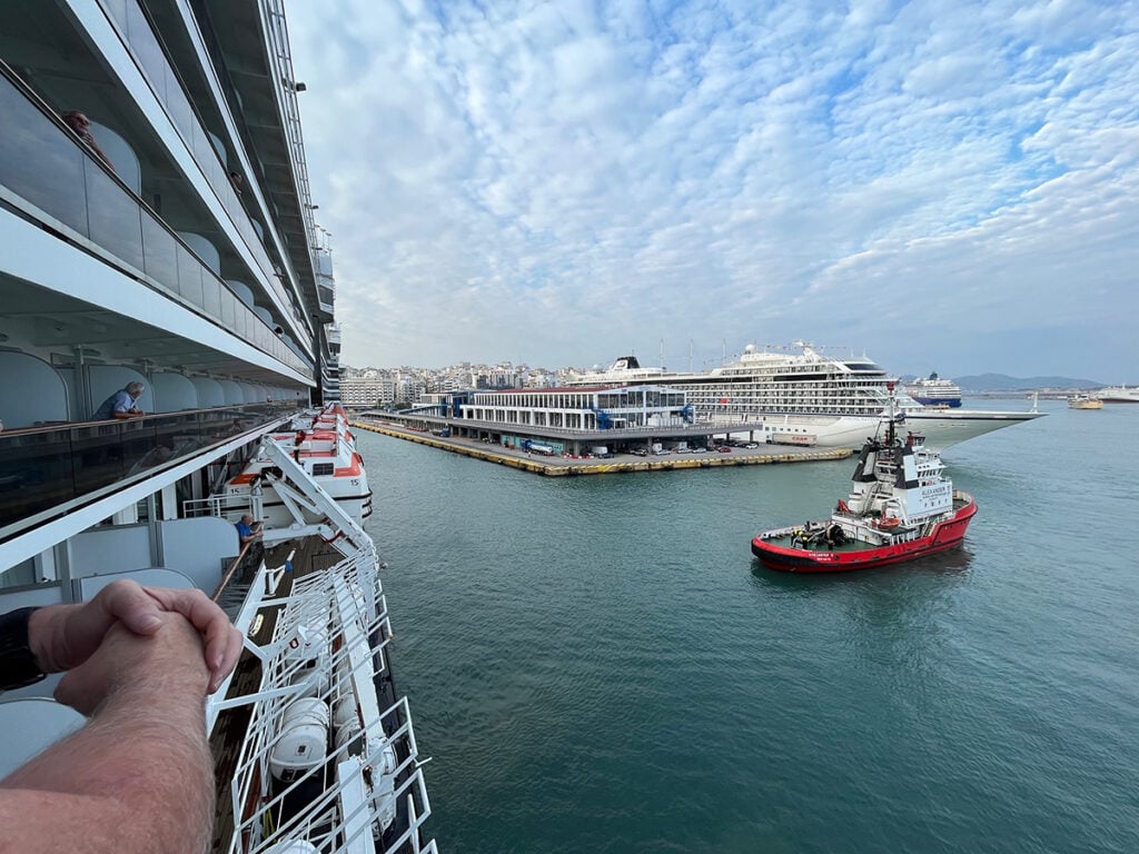 Looking over cruise balcony at pilot boat on harbour