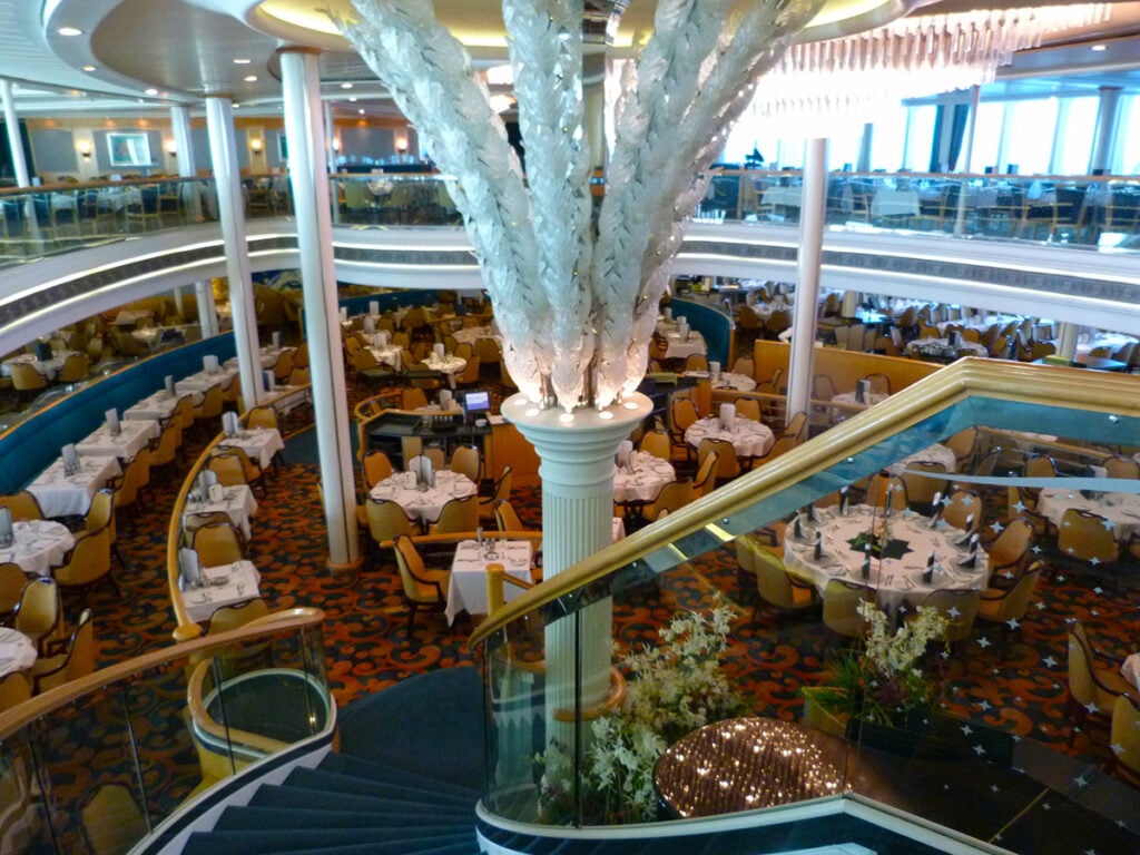Ship formal dining room with white tablecloths