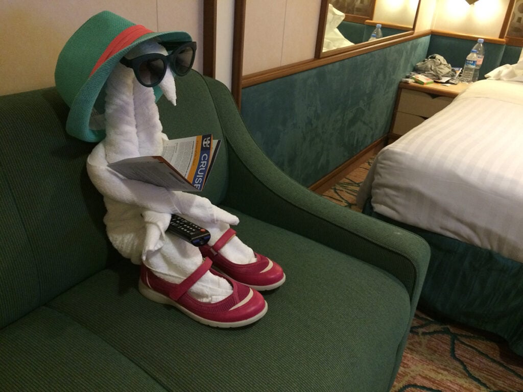 Towel art in my cabin wearing my shoes, sunglasses and hat