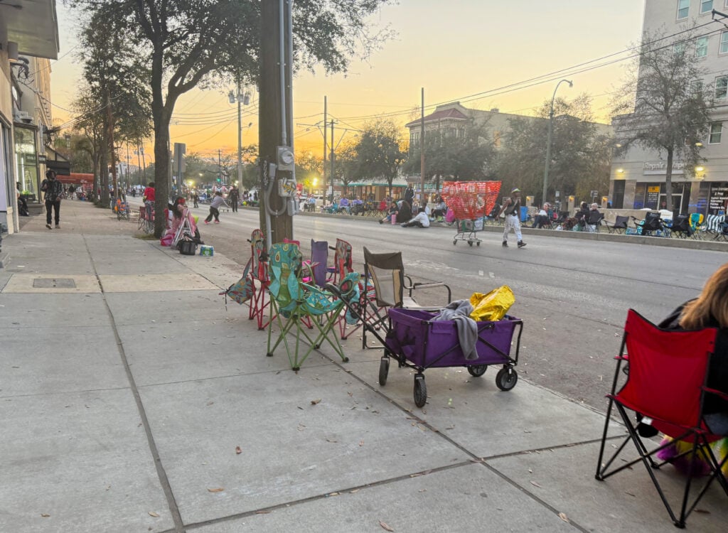 Chairs and trolleys lined up on the sidewalk early on St Charles