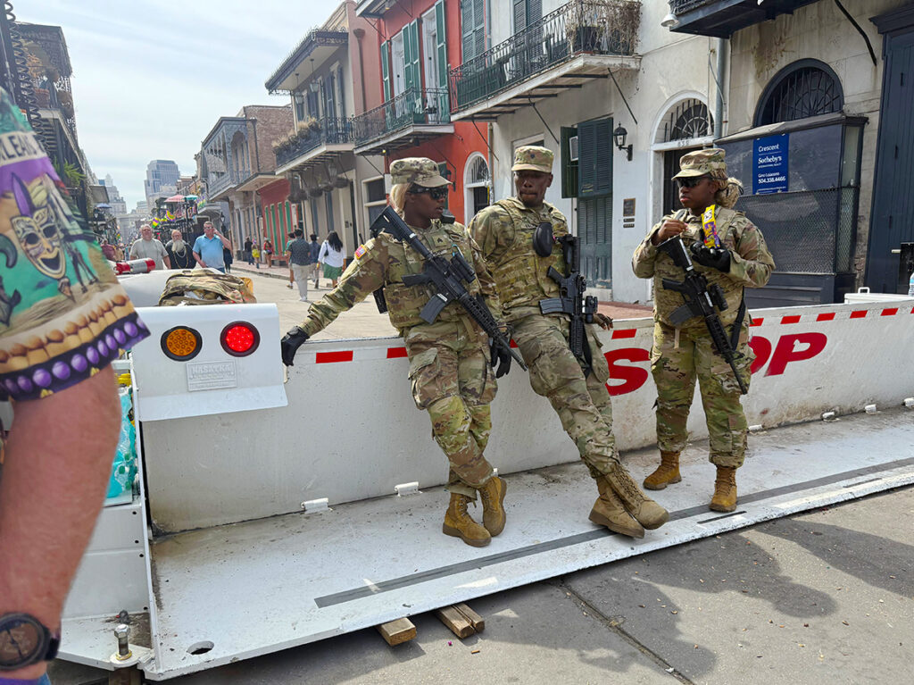 Guards standing at a road closure into the French Quarter
