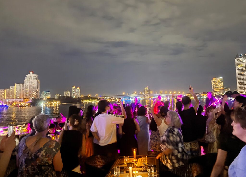 Cameras and dancing on the top deck of our dinner cruise