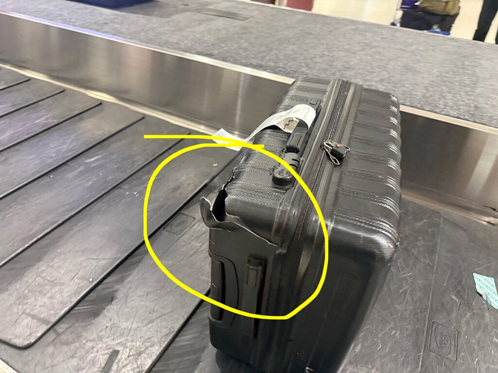 Damaged luggage on carousel