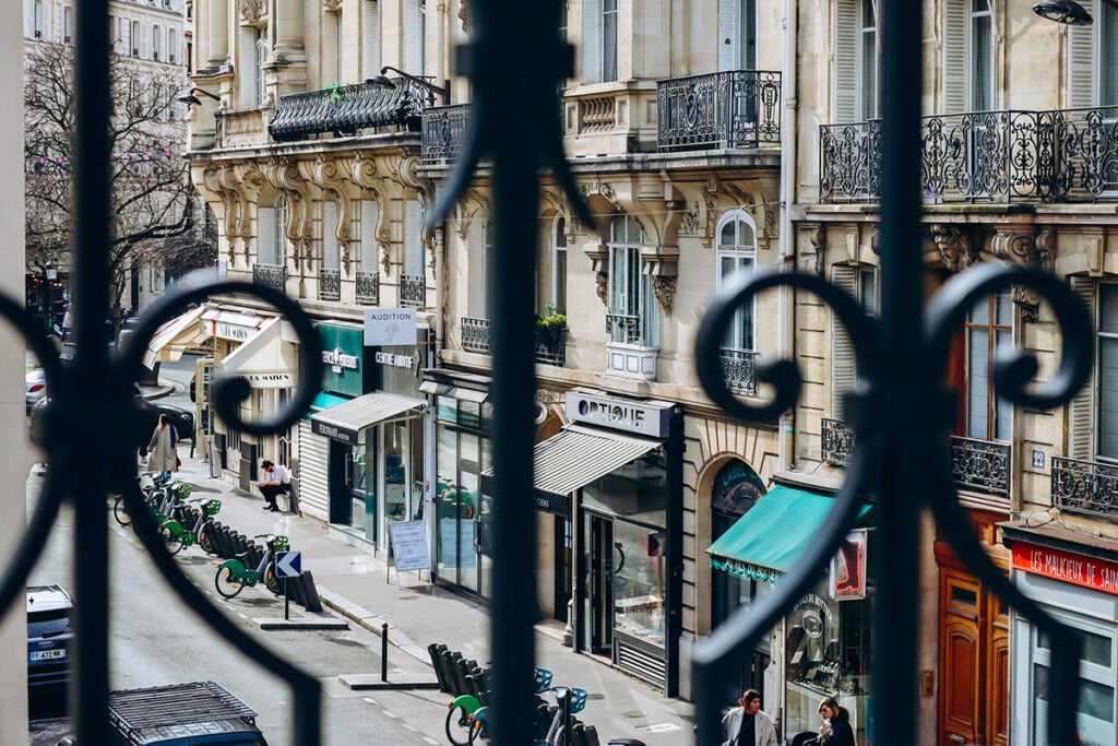 Looking through the wrought iron railings to the street in the 17th arrondissement